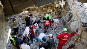 Rescuers inspect the site of an Israeli strike that hit a building. The cost of rebuilding Lebanon could exceed $25 billion